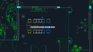 CAD floor plan of a conference area with a rectangular table and chairs around it, plus plant decor along the walls