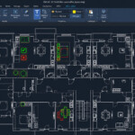 Top-down AutoCAD floor plan of an office layout with rooms, doors, and furniture; green checkmarks and red X markers indicate status or issues.
